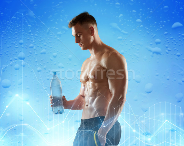 young man or bodybuilder with bottle of water Stock photo © dolgachov