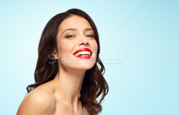 Güzel gülen genç kadın kırmızı ruj güzellik makyaj Stok fotoğraf © dolgachov