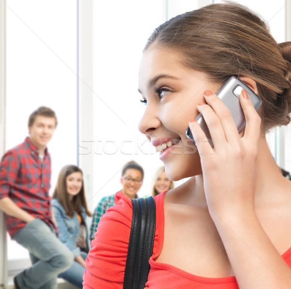 student girl with cell phone at school Stock photo © dolgachov