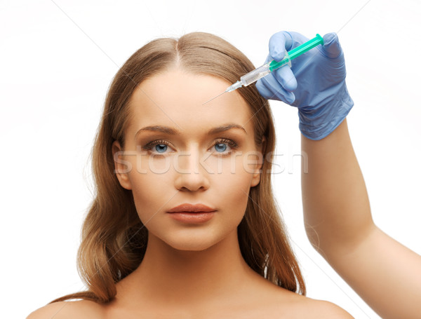 Vrouw gezicht handen spuit cosmetische chirurgie hand vrouw Stockfoto © dolgachov