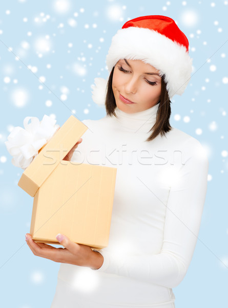 Gyanús nő mikulás segítő kalap ajándék doboz Stock fotó © dolgachov