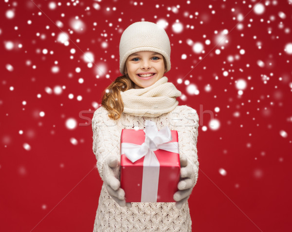 girl in hat, muffler and gloves with gift box Stock photo © dolgachov