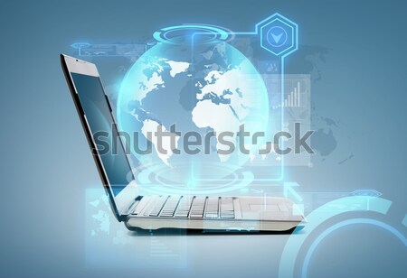 Dwa laptop komputerów mapie świata hologram technologii Zdjęcia stock © dolgachov