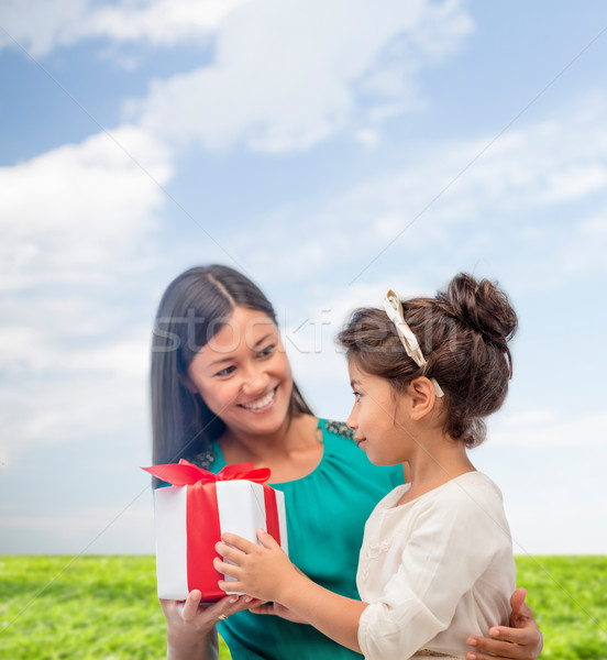 happy mother and child girl with gift box Stock photo © dolgachov