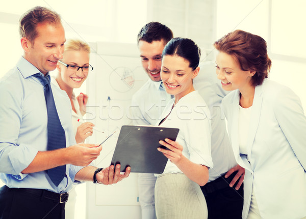 üzleti csapat megbeszél valami iroda mosolyog üzlet Stock fotó © dolgachov