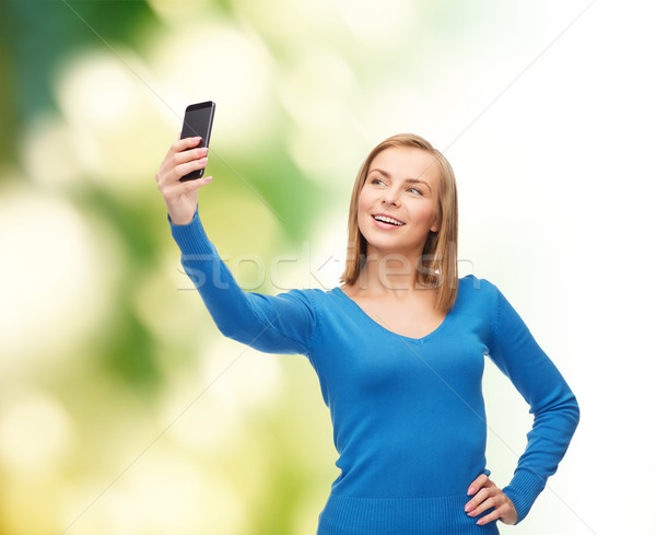 woman taking self picture with smartphone camera Stock photo © dolgachov