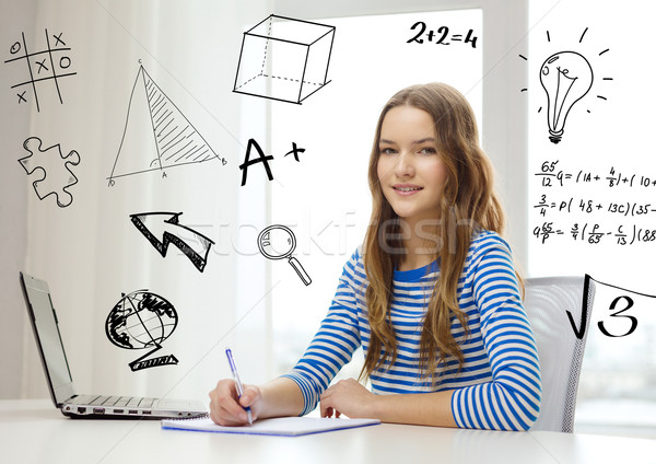 smiling teenage girl laptop computer and notebook Stock photo © dolgachov