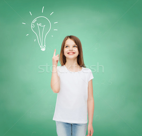 Uśmiechnięty dziewczynka biały tshirt reklamy gest Zdjęcia stock © dolgachov