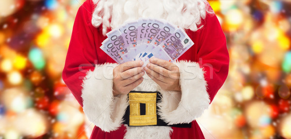 close up of santa claus with euro money Stock photo © dolgachov