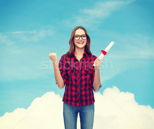 smiling female student in eyeglasses with diploma Stock photo © dolgachov