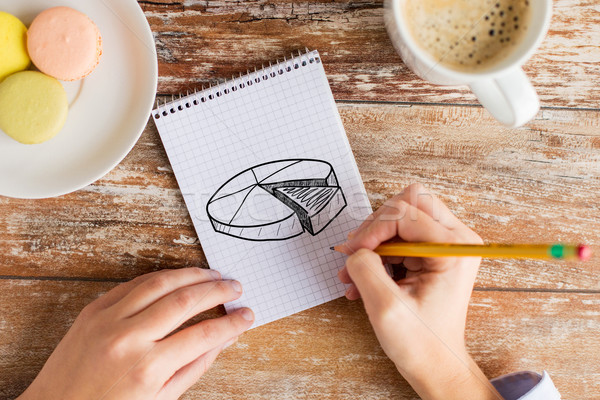 close up of hands drawing chart in notebook Stock photo © dolgachov