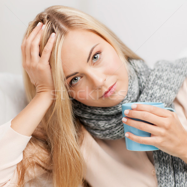 diseased woman with cup of tea Stock photo © dolgachov