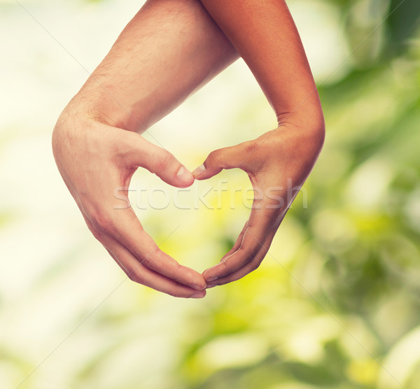 Donna uomo mani a forma di cuore amore Foto d'archivio © dolgachov