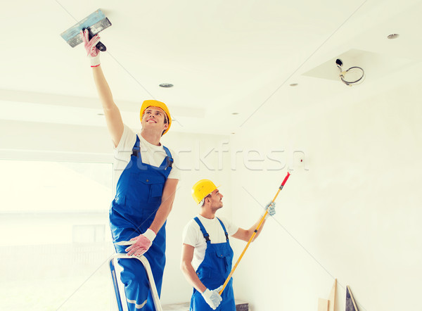 Stock photo: group of builders with tools indoors