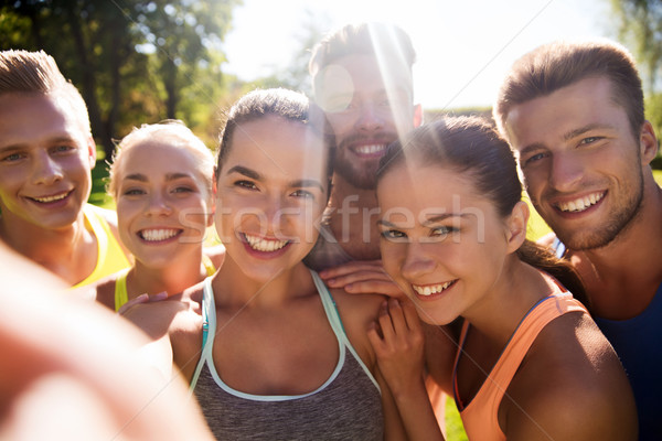 happy friends taking selfie with smartphone Stock photo © dolgachov