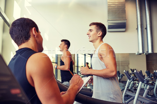 Stock photo: men exercising on treadmill in gym