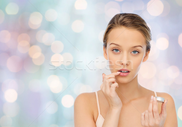 Młoda kobieta warga balsam usta piękna Zdjęcia stock © dolgachov