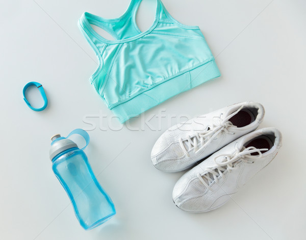 close up of sportswear, bracelet and bottle Stock photo © dolgachov