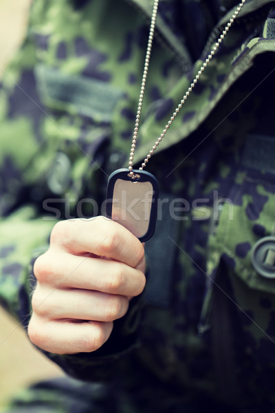 close up of young soldier in military uniform Stock photo © dolgachov