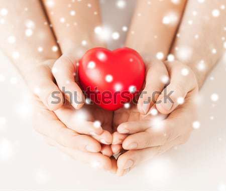 close up of happy male gay couple with love symbol Stock photo © dolgachov