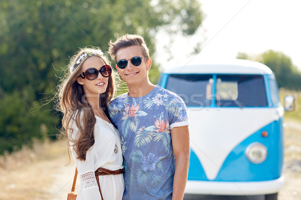 smiling young hippie couple over minivan car Stock photo © dolgachov