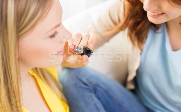 close up of visagist woman applying lipstick Stock photo © dolgachov