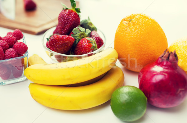 close up of fresh fruits and berries on table Stock photo © dolgachov