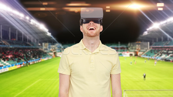 man in virtual reality headset over football field Stock photo © dolgachov