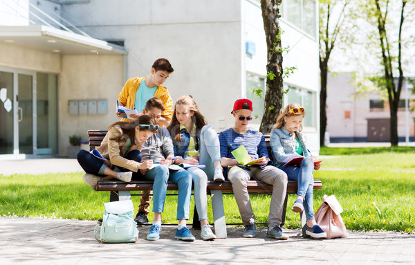 group of students with notebooks at school yard Stock photo © dolgachov