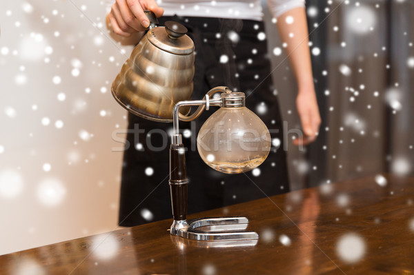 close up of woman with siphon coffee maker and pot Stock photo © dolgachov