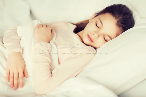 girl sleeping in bed at home Stock photo © dolgachov