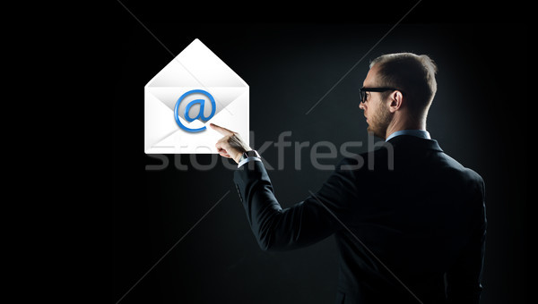 businessman pointing finger to Stock photo © dolgachov