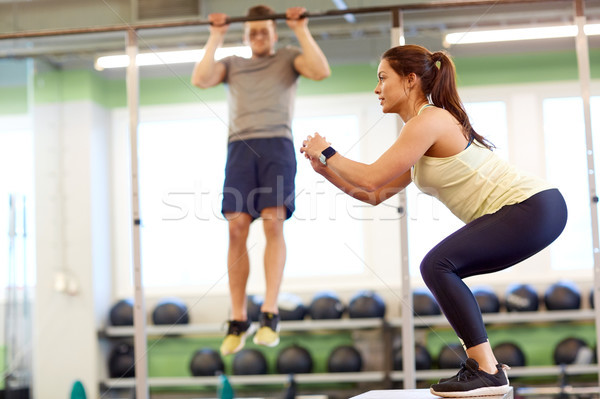 woman and man exercising in gym Stock photo © dolgachov