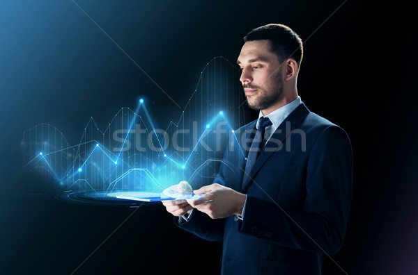 businessman with tablet pc and virtual charts Stock photo © dolgachov