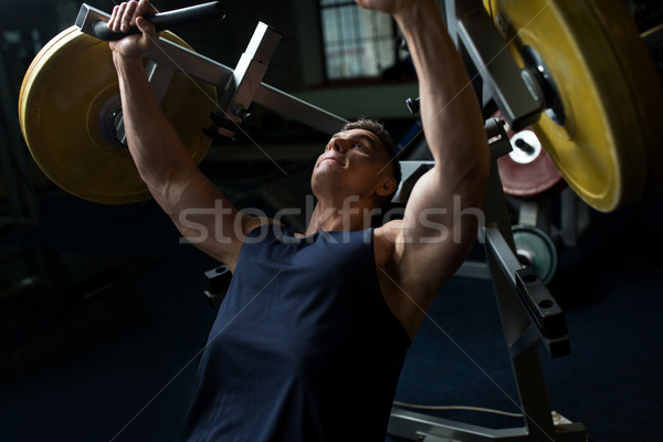 Foto stock: Hombre · pecho · prensa · ejercicio · máquina · gimnasio