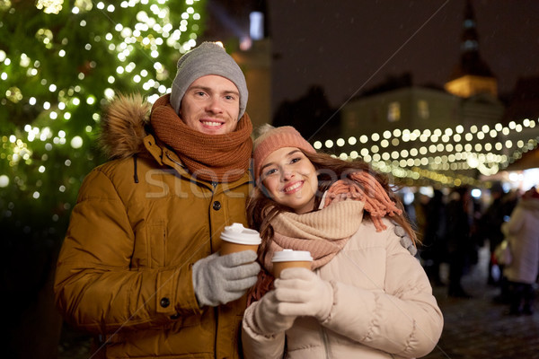 happy young couple with coffee at christmas market Stock photo © dolgachov