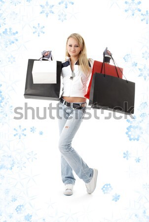 Vásárlás férfi jóképű férfi bevásárlótáskák hópelyhek divat Stock fotó © dolgachov