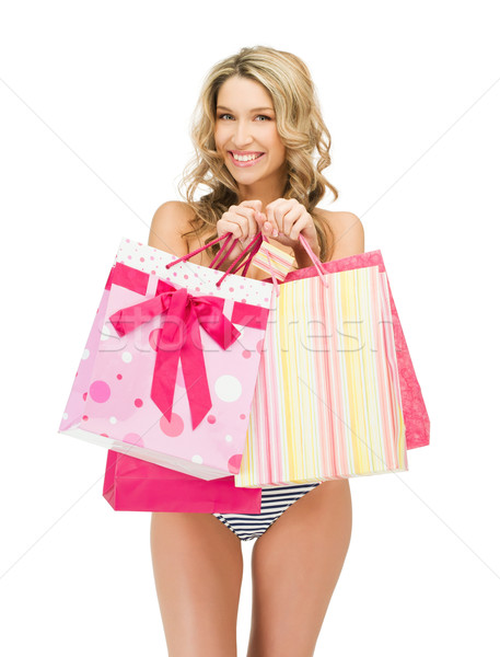 seductive woman in bikini with shopping bags Stock photo © dolgachov