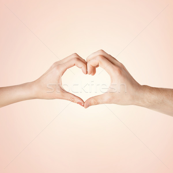 Mulher homem mãos forma de coração Foto stock © dolgachov