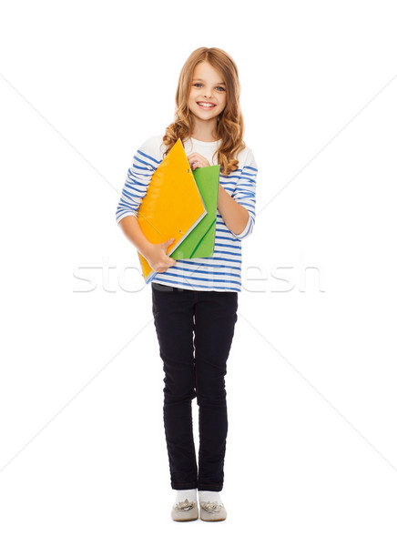 Gyermek tart színes mappák oktatás iskola Stock fotó © dolgachov