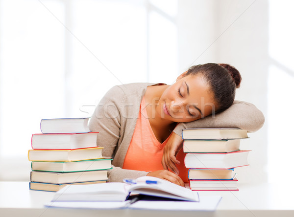 Zmęczony student książek zauważa edukacji działalności Zdjęcia stock © dolgachov