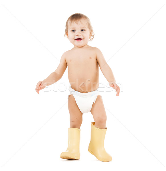 cute little boy walking in big rubber boots Stock photo © dolgachov