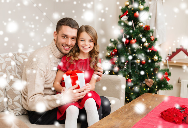 Stock photo: smiling father and daughter holding gift box