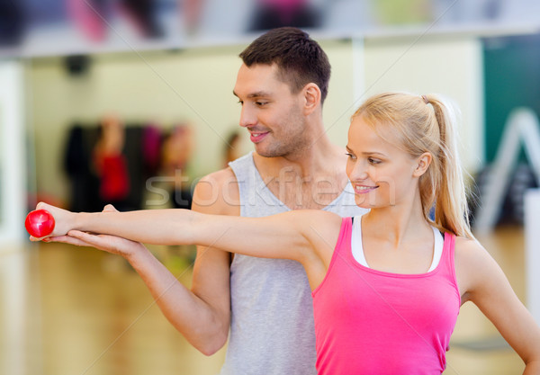 Homme entraîneur femme fitness [[stock_photo]] © dolgachov