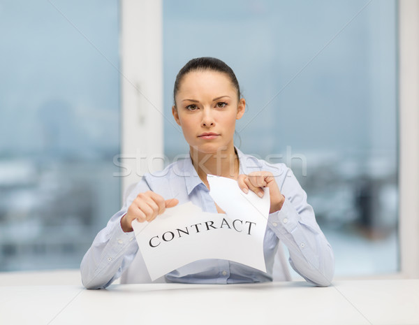 serious businesswoman tearing contract Stock photo © dolgachov