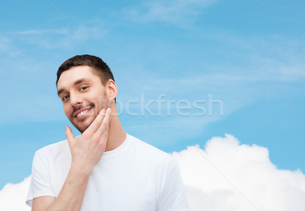 Schönen lächelnd Mann anfassen Gesicht Gesundheit Stock foto © dolgachov