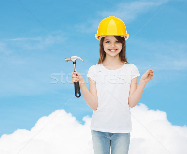 smiling little girl in hardhat with hammer Stock photo © dolgachov