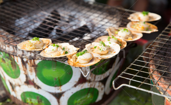 oysters or seafood grill at asian street market Stock photo © dolgachov
