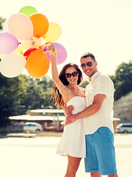 smiling couple in city Stock photo © dolgachov