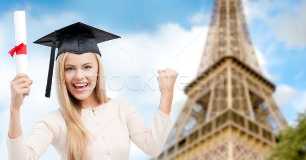 student in trencher with diploma over eiffel tower Stock photo © dolgachov